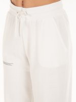 Jednokolorowe dziewczęce spodnie dresowe ze sznurowaniem, napisem i kieszeniami
