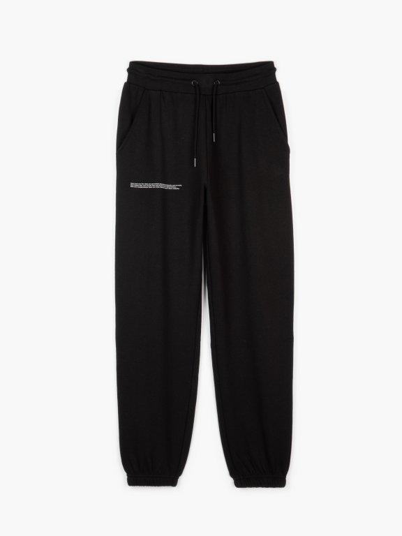 Lace up jogger fit sweatpants with message print and pockets