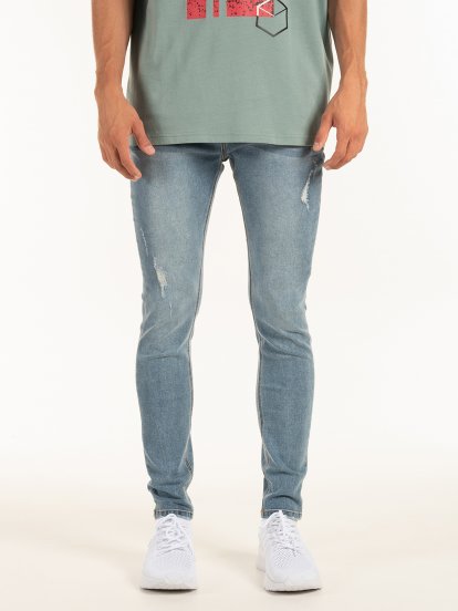 Slim fit distressed zip fly jeans