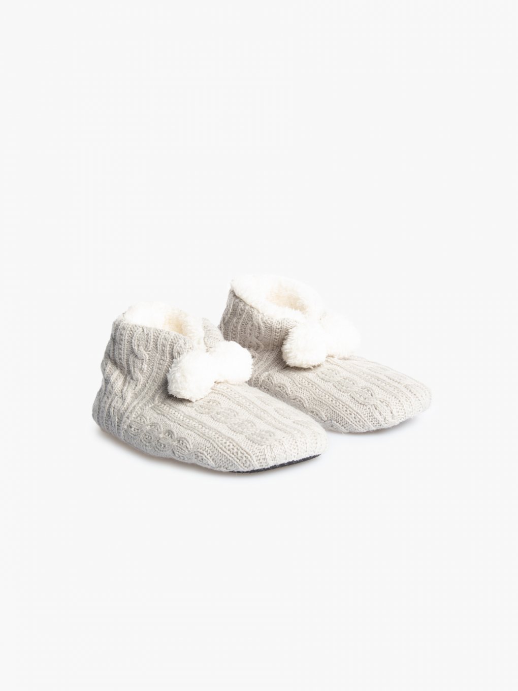 Warm slippers with pom poms