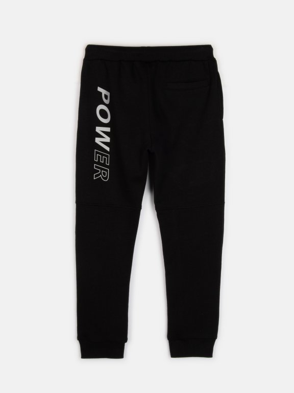 Sweatpants with mesh and reflective print