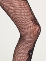 Fishnet tights with floral pattern