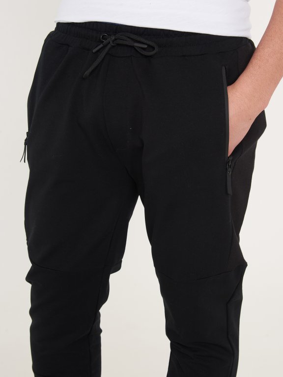 Męskie spodnie dresowe z suwakami
