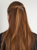 Bow shaped hairgrip