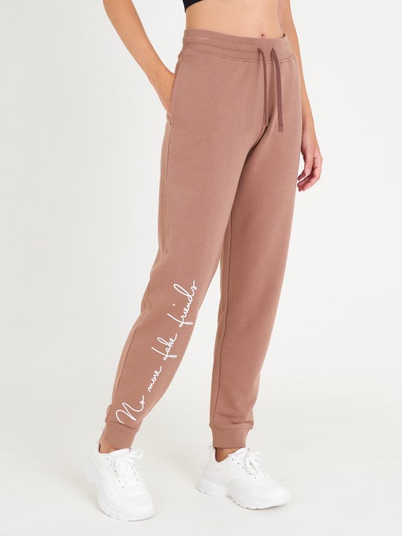 Teplákové kalhoty s nápisem dámské