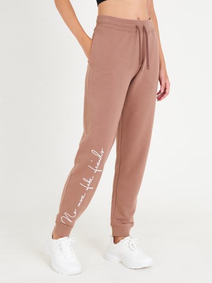 Teplákové kalhoty s nápisem dámské