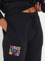 Sweatpants with slogan print