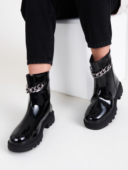Patent finish ankle boots with chain