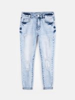 Distressed slim fit jeans and rolled up hems