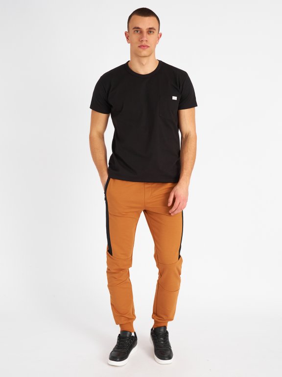 Sweatpants with reflective zipper pockets