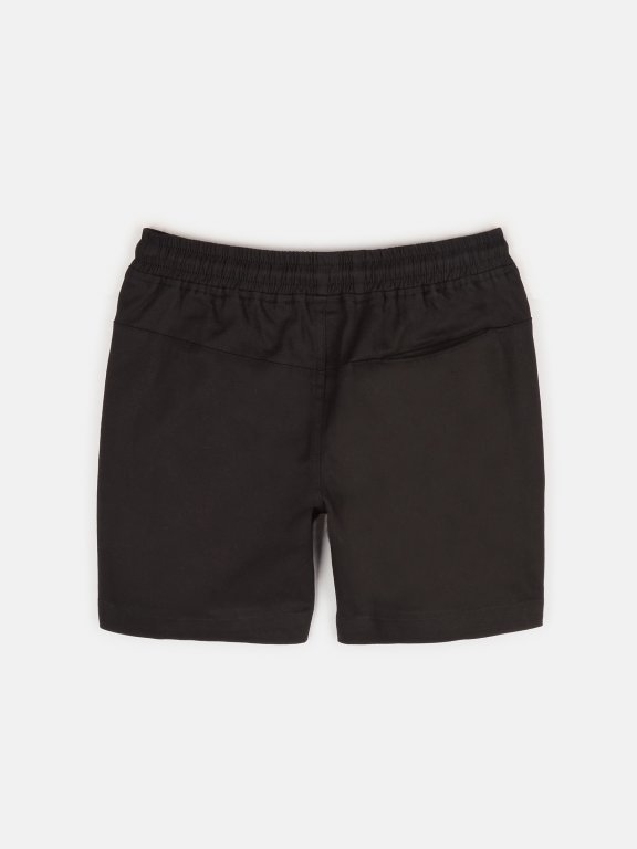 Elastic denim shorts with pockets