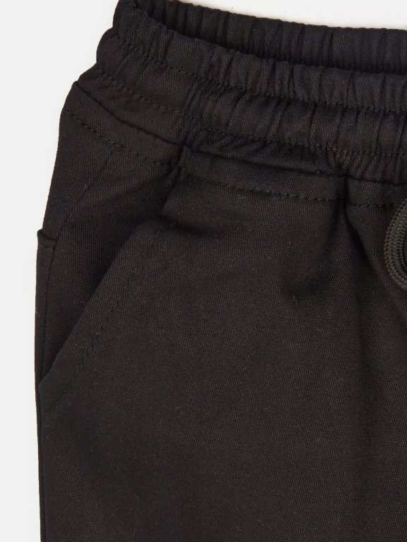 Elastic denim shorts with pockets