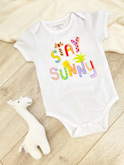 Cotton baby bodysuit with slogan print