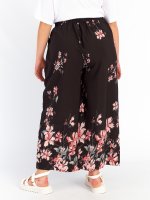 Květované kalhoty plus size dámské