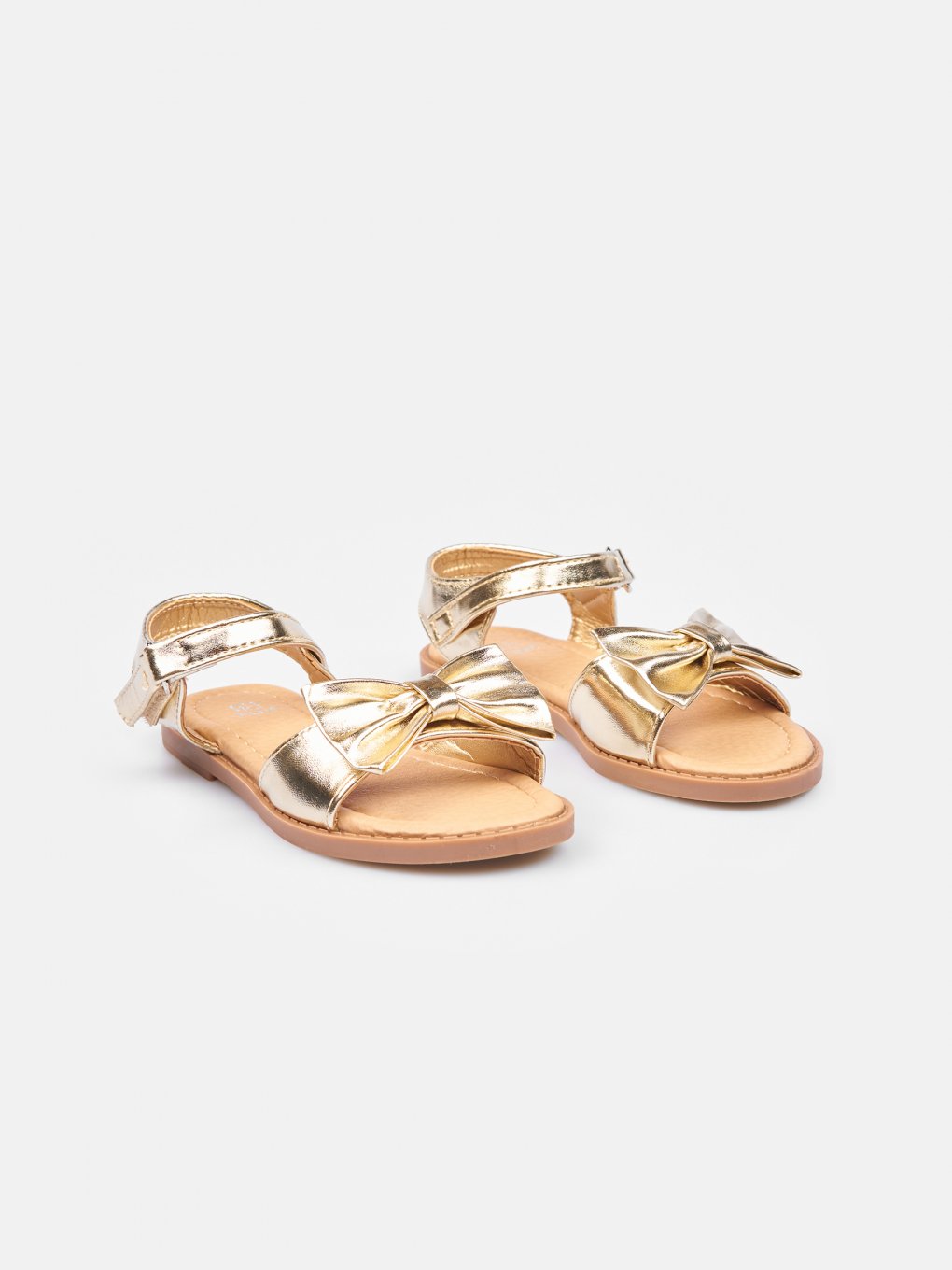Gold shiny sandals with bow