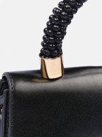 Handbag with decorative handle