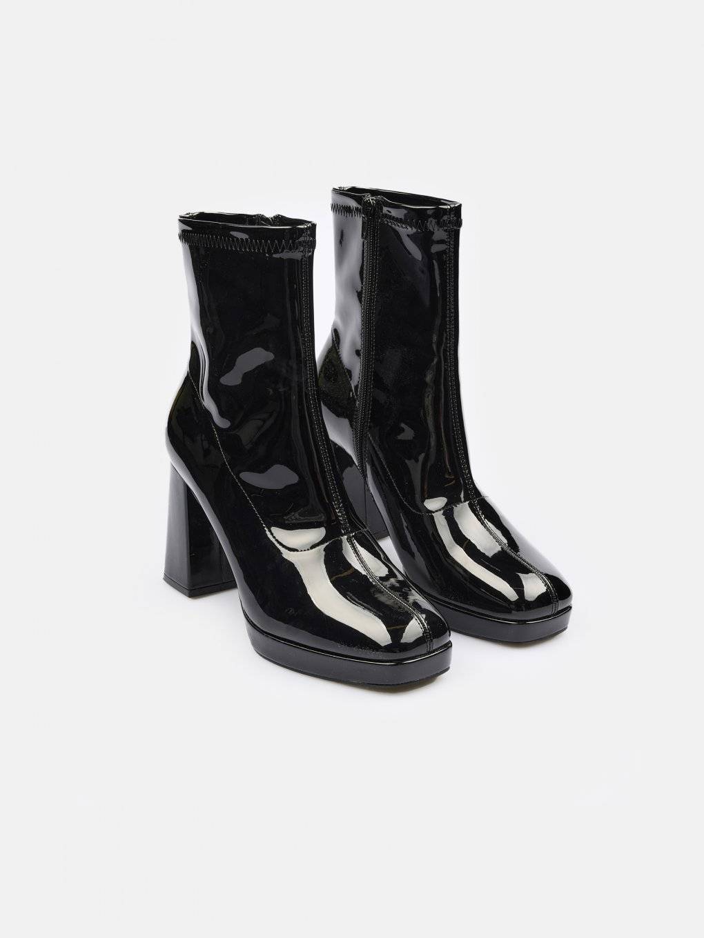 High heeled vinyl ankle boots