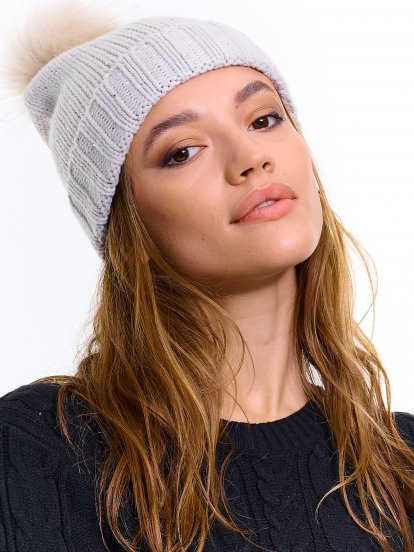 Knitted beanie with pom pom and stones