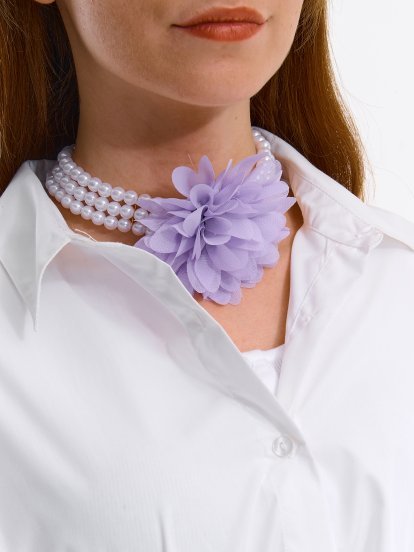 Beaded necklace with removable flower embellishment